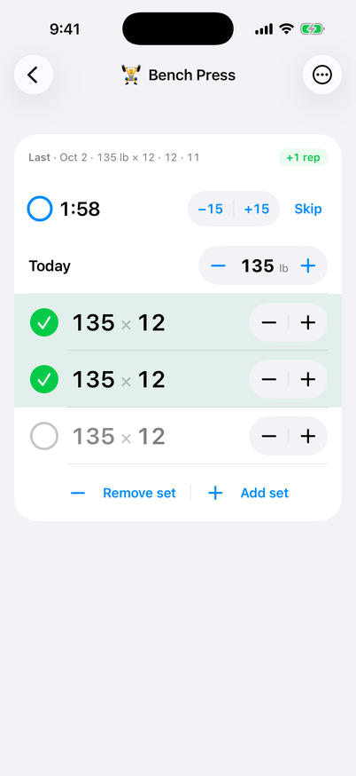 Bench Press logging page. The last session, on October 2, reads 135 lb for 12, 12 and 11 reps. A rest countdown at 1:58 sits above today's session weight of 135 lb. Two sets of 12 are checked off and the third is still open.